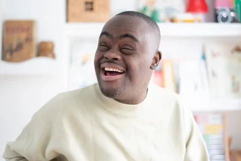Man with Down syndrome smiling