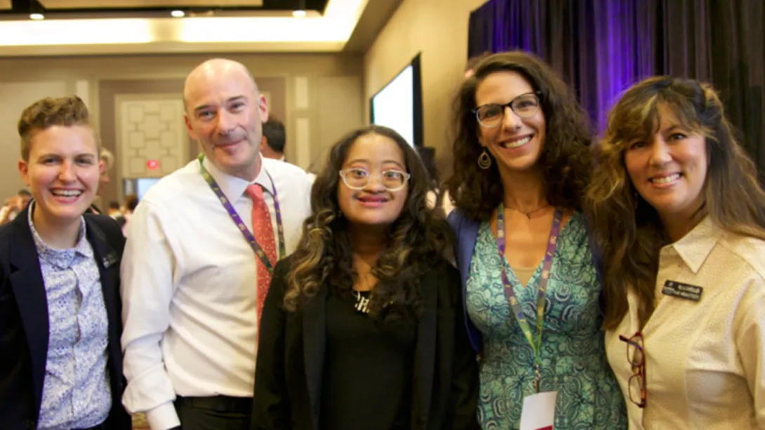 GLOBAL leadership and affiliates posing with a self-advocate