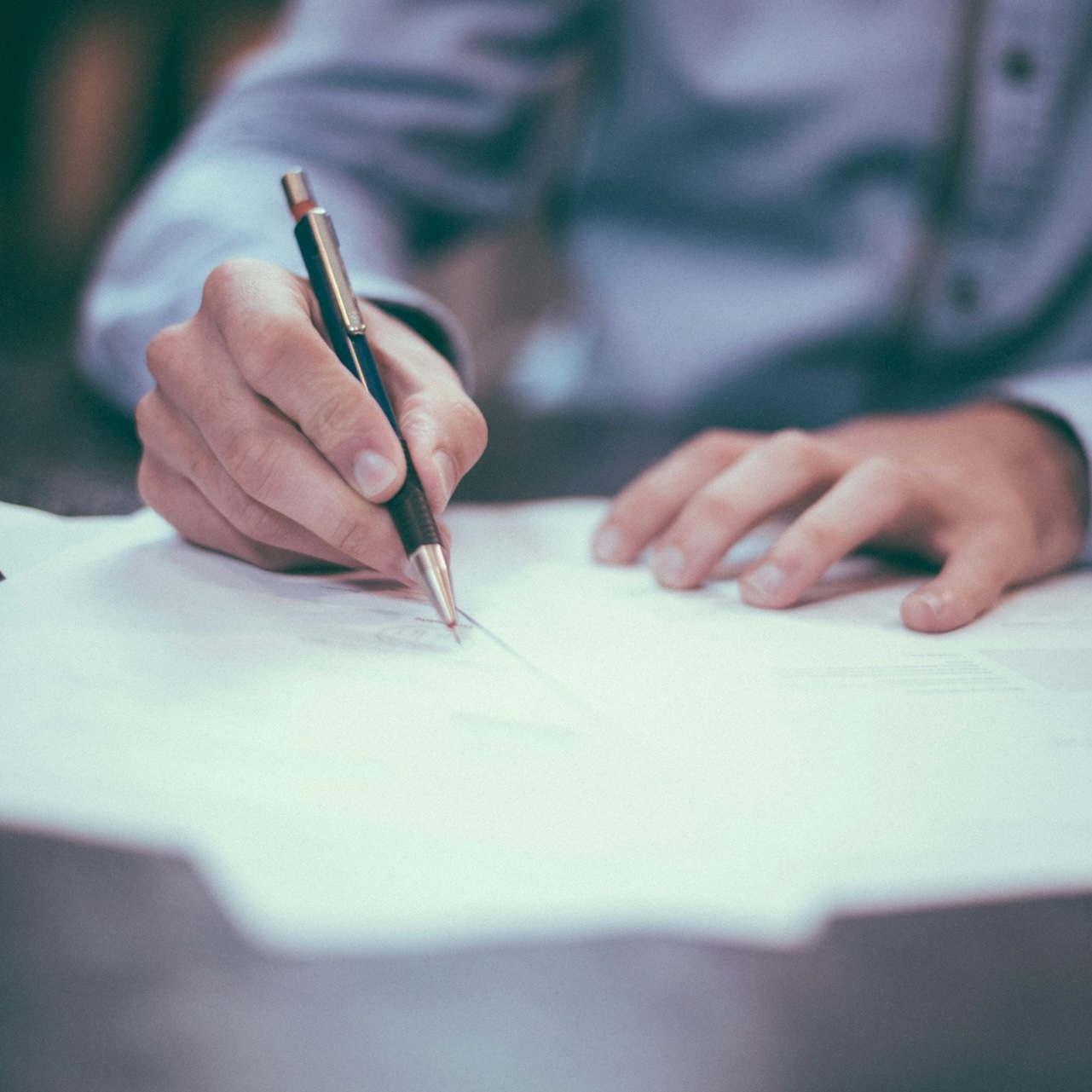 Man writing on a survey