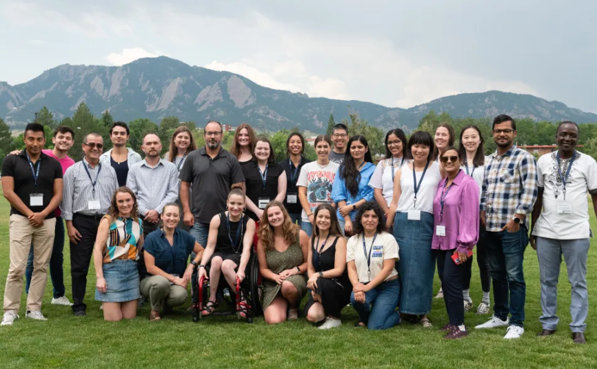 DS3 students posing in front of a mountain