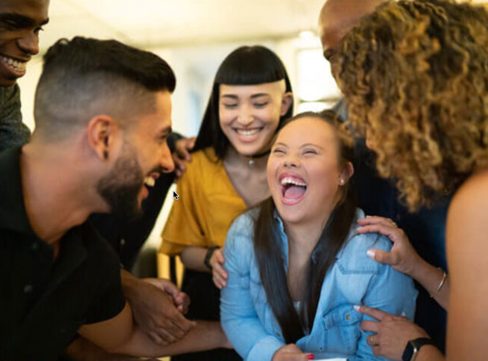 Woman with Down syndrome laughing with friends