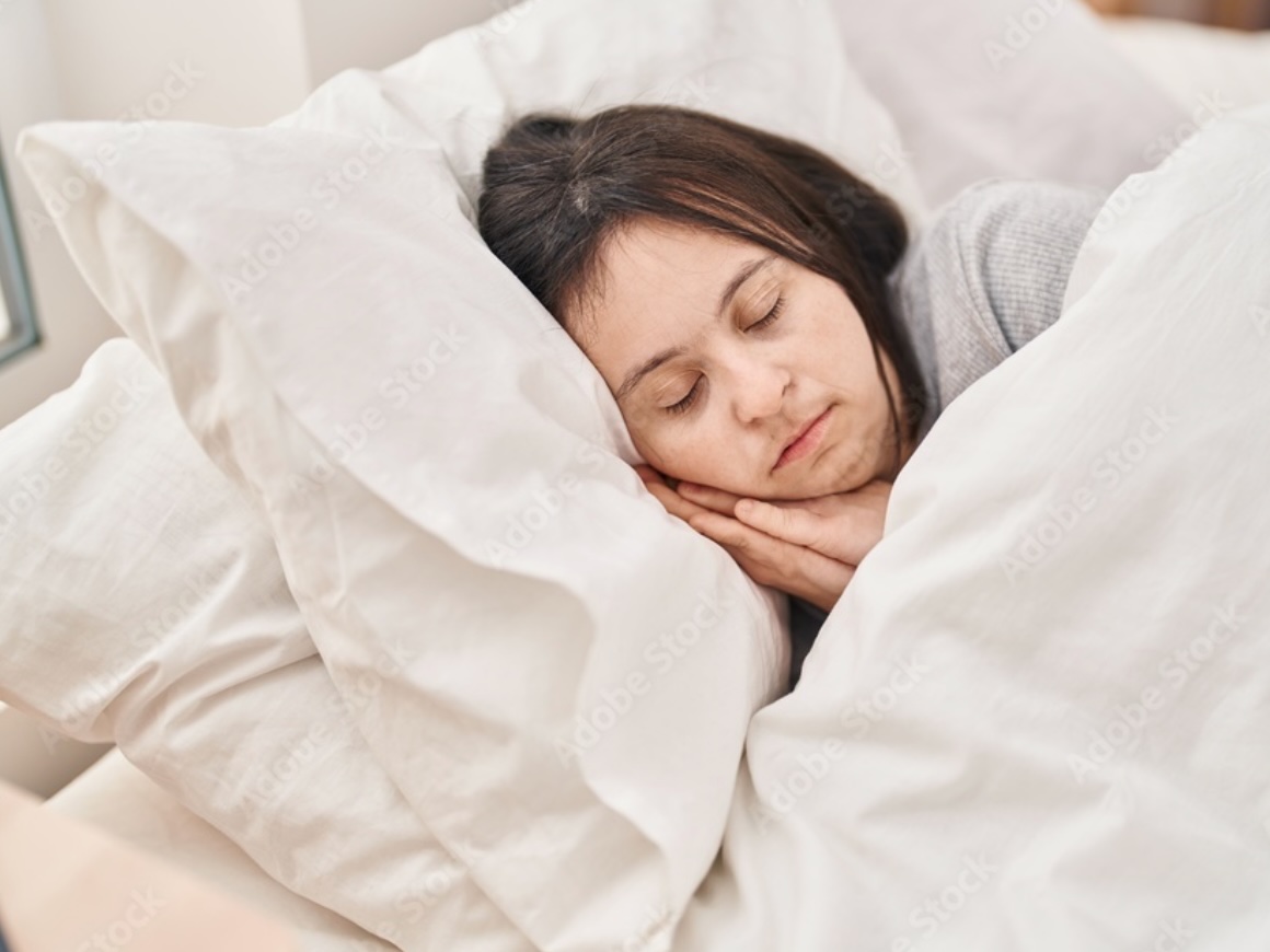 an individual with Down Syndrome is sleeping