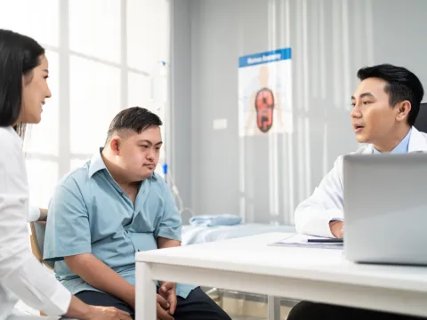 individual with Down syndrome at the doctors office