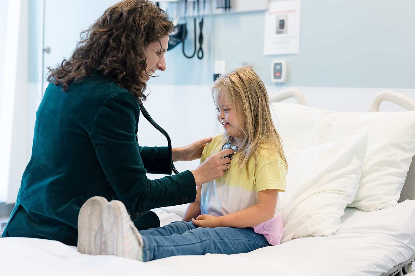 Girl with Down syndrome with a doctor